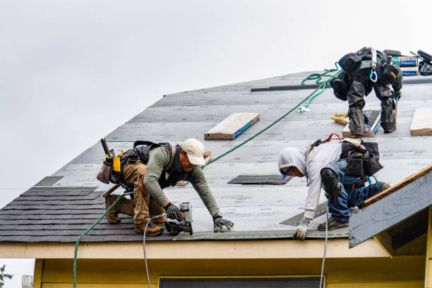 Professional Roofing technician working in Cadogan, PA
